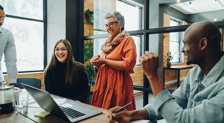 A woman standing in front of two other people. providing expert legal guidance.