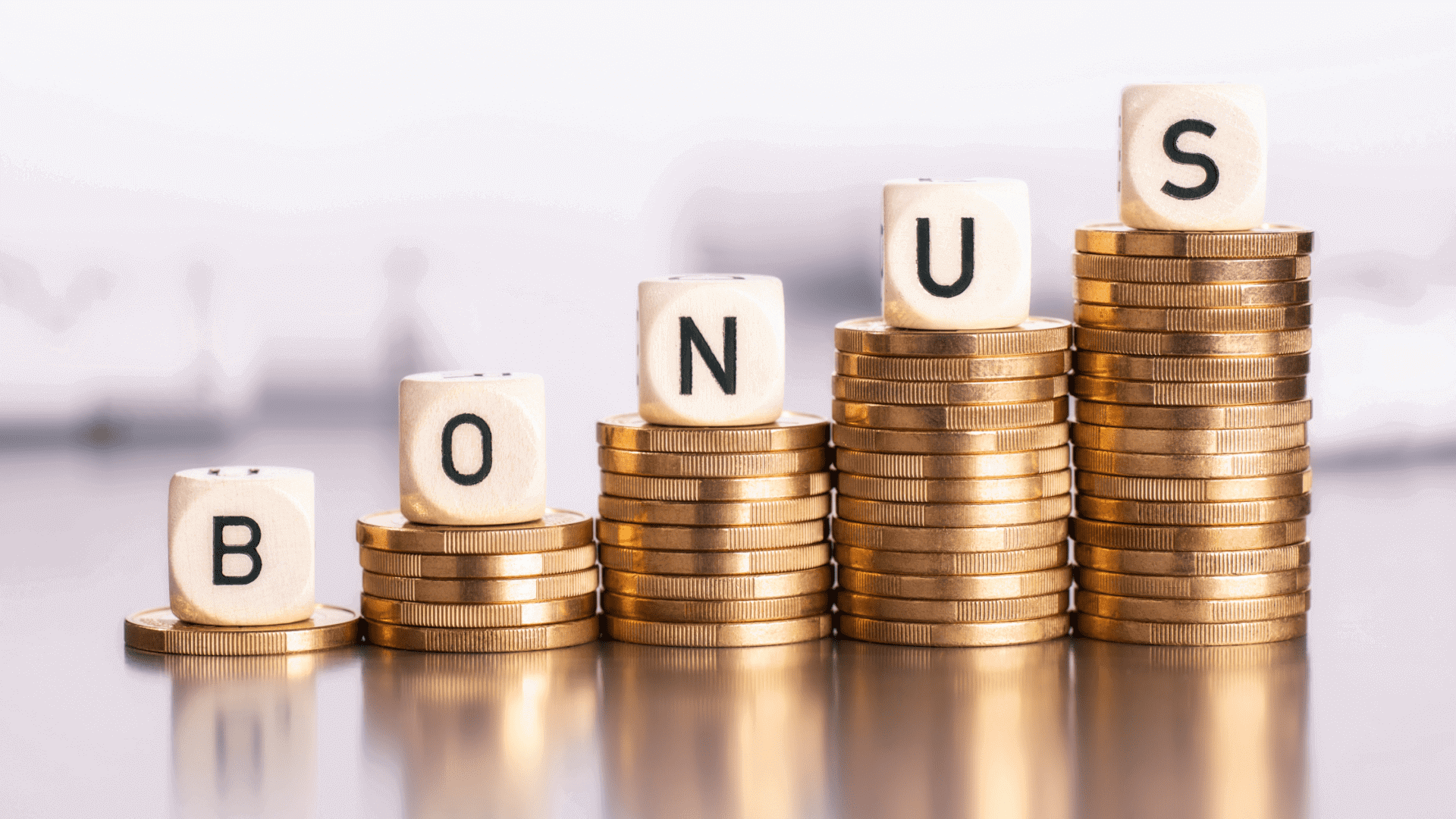 Stacks of coins spelling out "BONUS" letters.