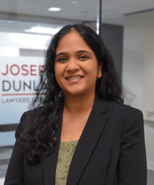 Smiling woman in an office setting.