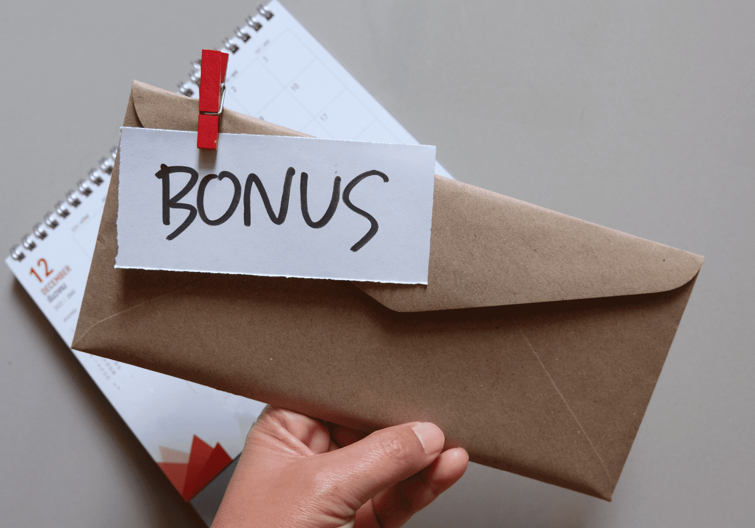Worker receiving a bonus for working overtime.