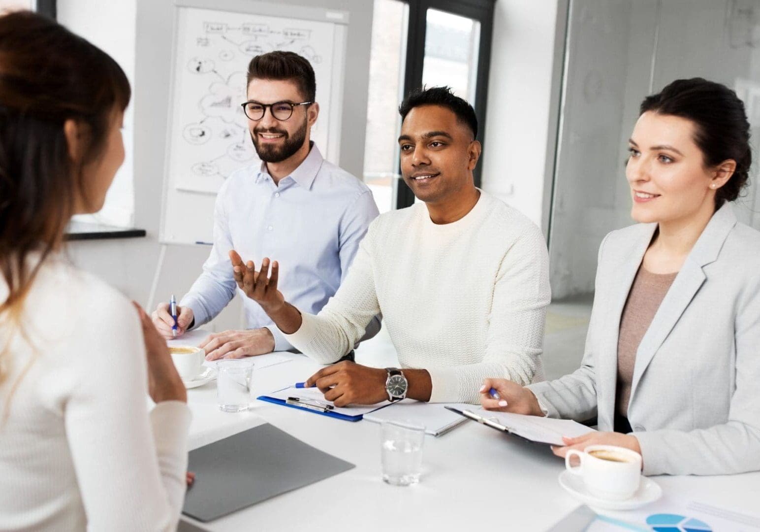 Three interviewers evaluating a candidate